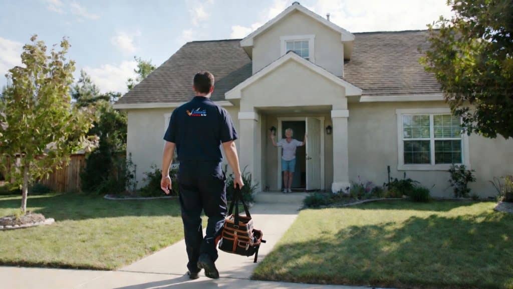 An HVAC service technician going to a customer's house in Stockbridge GA